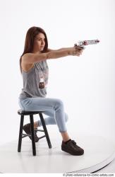 MOLLY SITTING POSE WITH GUN
